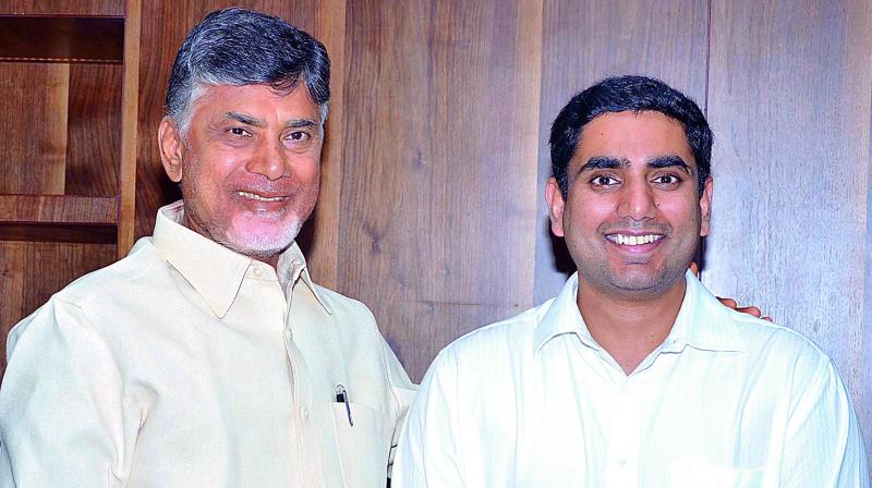 Chief Minister N. Chandrababu Naidu congratulates his son Nara Lokesh after he took charge as MLC at the Council on Thursday. (Photo: DC)