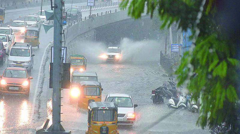 Water stagnated at the Begumpet flyover due to the heavy downpour on Thursday evening causing inconvenience to motorists. (Photo: DC)