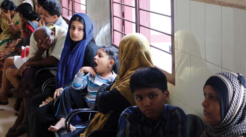 Fever patients wait at the outpatient wing of Government General hospital at Kozhikode beach on Monday. (Photo: DC)