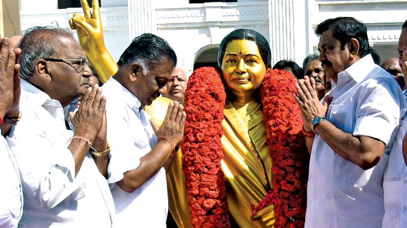 Chief Minister Edappadi K. Palaniswami and Deputy Chief Minister O. Panneerselvam pay tribute to former chief minister J. Jayalalithaa on her 71st  birth anniversary at party headquarters in Chennai on  Sunday. (Photo: DC)