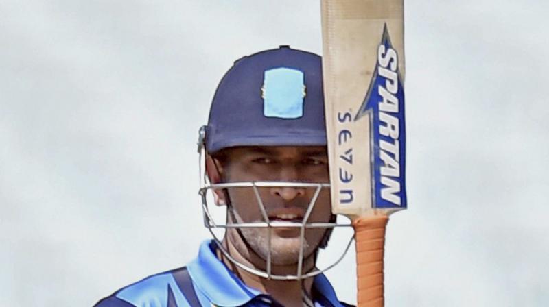MS Dhoni survived some anxious moments en route a 107-ball 129. (Photo: AP)