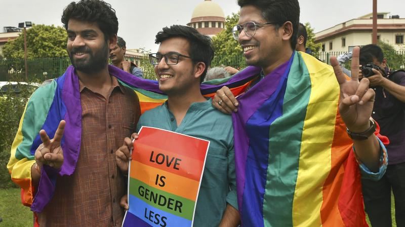 People react after the Supreme Court verdict which decriminalises consensual gay sex in New Delhi on Thursday. (Photo: PTI)