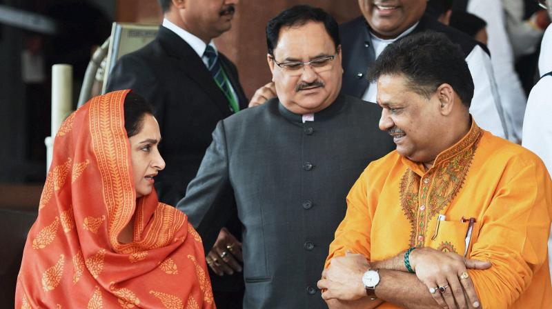 Union Health Minister Jagat Prakash Nadda with Union Food Processing Industries Minister Harsimrat Kaur Badal and Expelled BJP MP Kirti Azad and at Parliament during the winter session, in New Delhi. (Photo: PTI)
