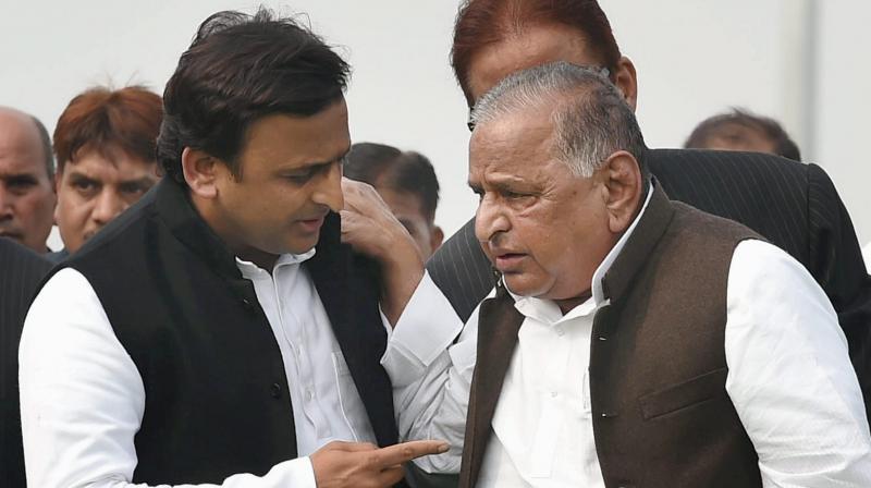 SP supremo Mulayam Singh Yadav and UP CM Akhilesh Yadav during a function in Lucknow. (Photo: PTI)