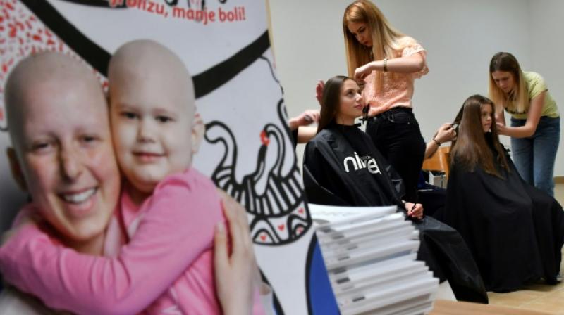 As trivial as it might seem at first while a person is battling such an aggressive disease, hair loss is often a huge psychological burden. (Photo: AFP)