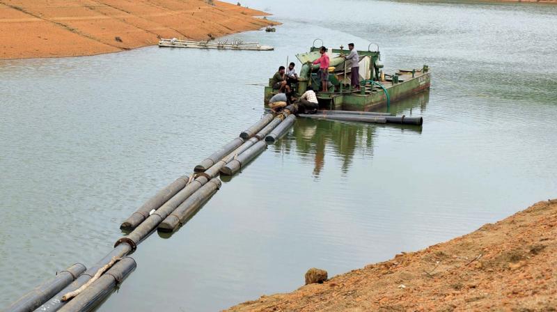 Pipes being connected to the second dredger that arrived at Neyyar dam on Monday. 	(Photo: SABARINATH R, )