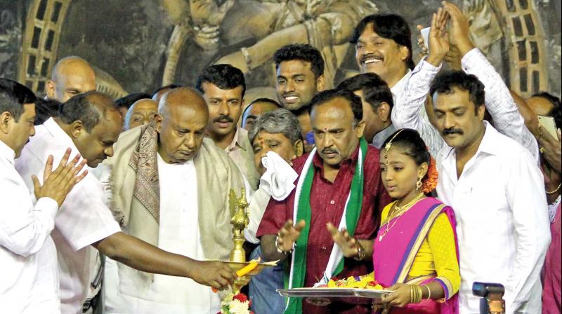 JD(S) supremo H.D. Deve Gowda and state president H.D. Kumaraswamy at a party meet in the city.