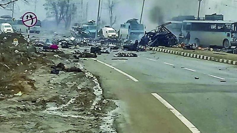 A scene of the spot after militants attacked a CRPF convoy in Goripora area of Awantipora town in Pulwama district of J&K. At least 49 CRPF jawans were killed in the attack. (Photo: PTI)