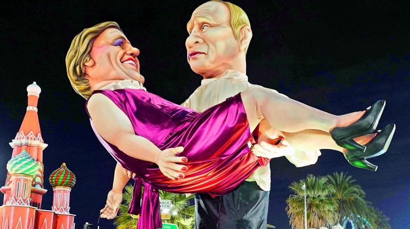 Statues of French actor Gerard Depardieu and Russian President Vladimir Putin parade during the Nice Carnival Parade in Nice, south-eastern France on Wednesday. 	 AFP