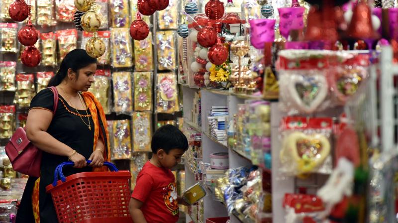 A woman and a boy check out products for Christmas shopping. Merchants have reported poor sales this year due to cash crunch.