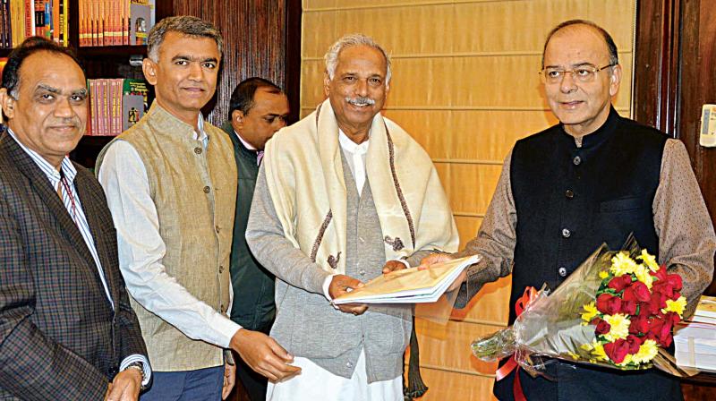 Revenue Minister Kagodu Thimmappa and Agriculture Minister Krishna Byre Gowda call on Union Finance Minister Arun Jaitley in New Delhi on thursday. (Photo: KPN)