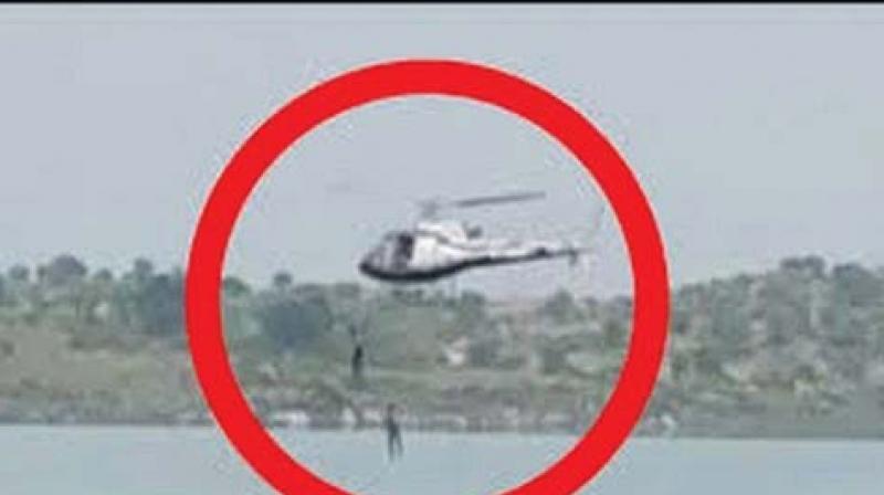 A file photo of two artistes jumping into Thippagondanahalli lake while shooting an action scene