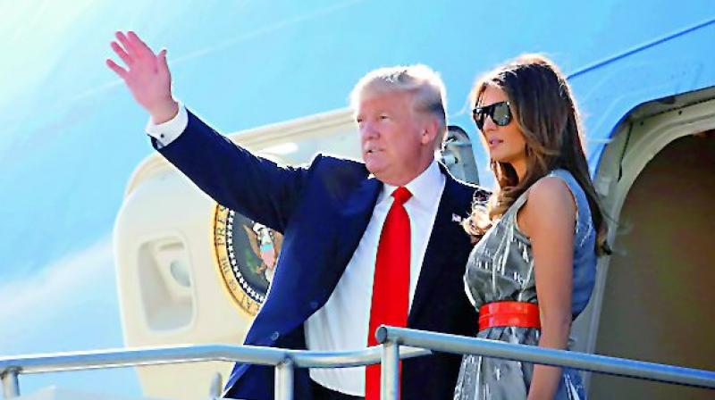 President Donald Trump and First Lady Melania board the Air Force One.