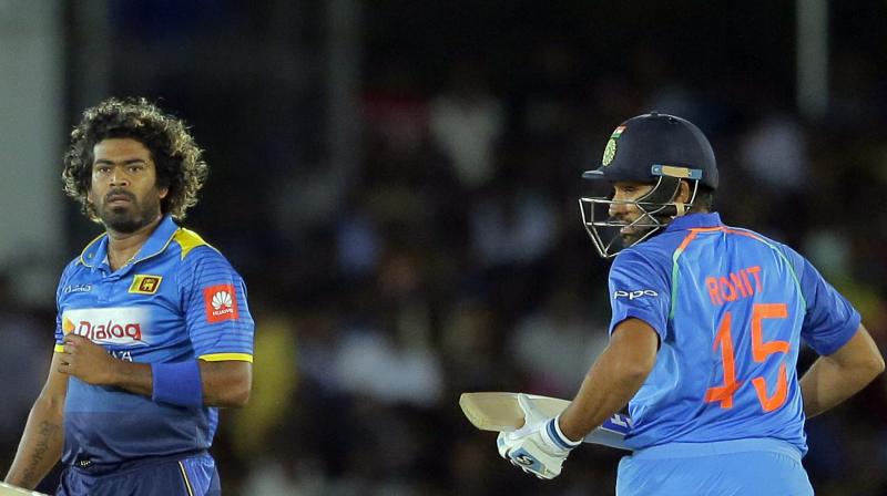 Lasith Malinga was congratulated by India batsman Rohit Sharma on claiming his 300th ODI wicket. (Photo: AP)