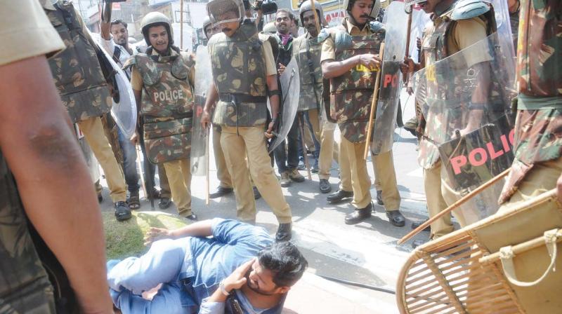A KSU activist thrown on floor after he was beaten up by the policemen during an agitation against Law Academy Law College in front of the secretariat in Thiruvananthapruamon Thursday. (Photo: A.V. MUZAFAR)