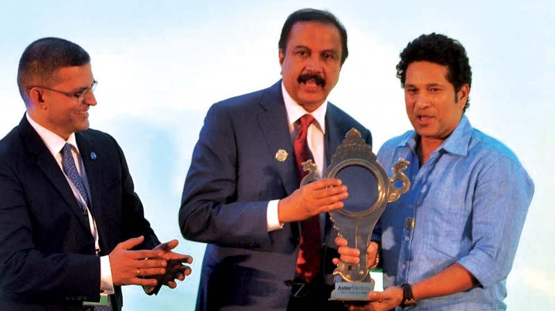 Legendary Cricketer Sachin Tendulkar accepting a memento from Chairman of Aster DM Healthcare Dr. Azad Moopan at the launch of Centre For Sports Medicine at Aster Medcity in Kochi on Thursday. Aster Medcity CEO Dr. Harish Pillai is also seen. (Photo: SUNOJ NINAN MATHEW)