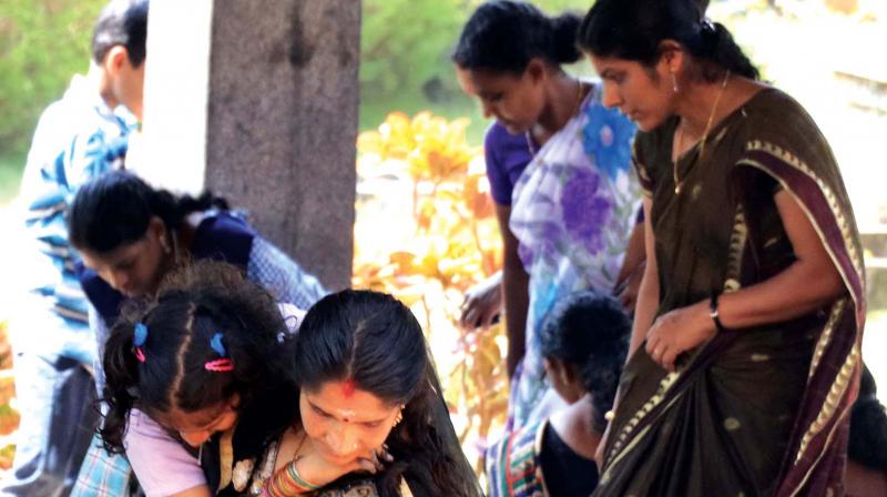 A child who came to participate in the Kudumbashree BUDS Fest is being carried by her mother at Vyloppilly Samskruthi Bhavan on Thursday. 	(Photo: Mohammed Mazhar)