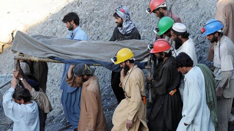 Rescue workers recovered the bodies of seven mine workers who were buried under a landslide in the countrys southwest, officials said Sunday. (Photo: AFP)
