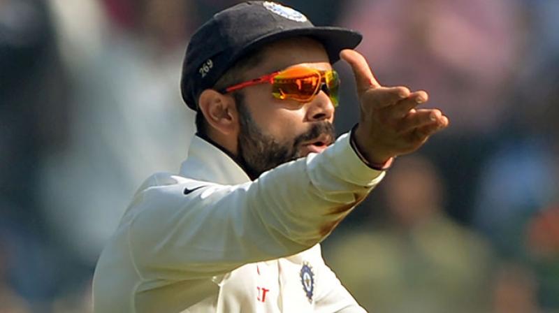 Virat Kohli has found himself embroiled in a controversy over his \I dont think you should live in India\ response to an enthusiast who called the skipper overrated while expressing his admiration for English and Australian batsmen. (Photo: AFP)