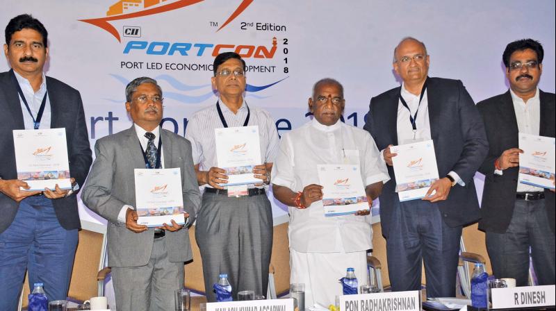 Union minister Pon Radhakrishnan releases the book  on the theme Port Led Economic Development at the CII Port conclave 2018 organised by CII- Southern Region in Chennai on Tuesday. (Photo: DC)