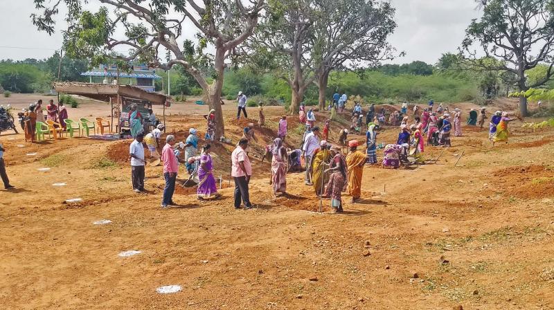Women workers digging water conservation trenches under MGNREGS at Pillaiyarpatti village near Thanjavur. (Photo: DC)
