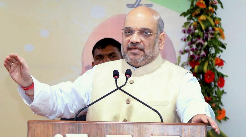 BJP National President Amit Shah addresses a meeting of party MPs, MLAs, State Office Bearers, District Presidents and Mandal Presidents in Raipur, Chhattisgarh. (Photo: PTI)
