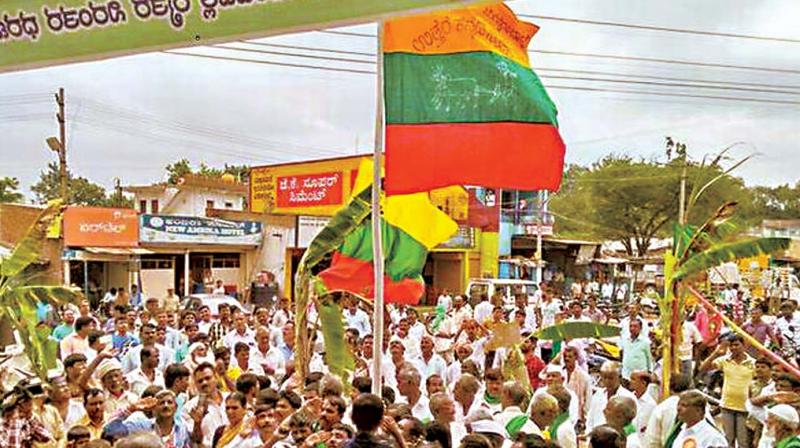 A file photo of people agitating for Mahadayi water hoisting the flag of North Karnataka state at Navalgund.
