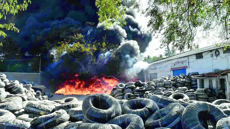 Plastic pipes burn at a godown in Bowenpally on Sunday. The pipes caught fire from garbage being burnt nearby. (Photo: DC)