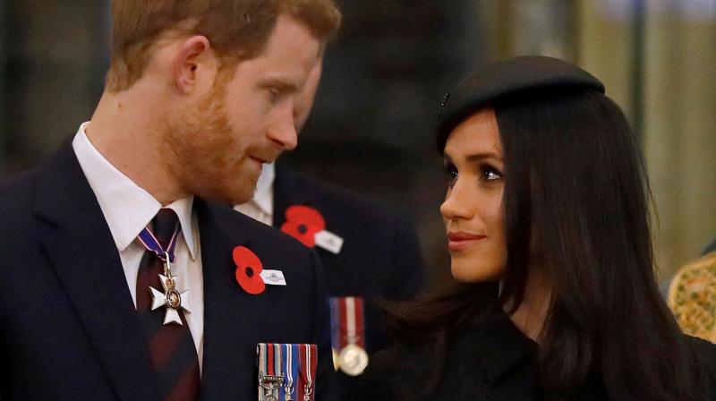 Britains Prince Harry (L) and his US fiancee Meghan Markle attend a service of commemoration and thanksgiving to mark Anzac Day in Westminster Abbey in London on April 25, 2018. (Photo: AFP)