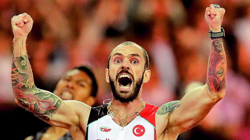Ramil Guliyev of Turkey celebrates after crossing the line to win gold in the mens 200 metres final at the World Athletics Championships in London on Thursday. (Photo: AP)