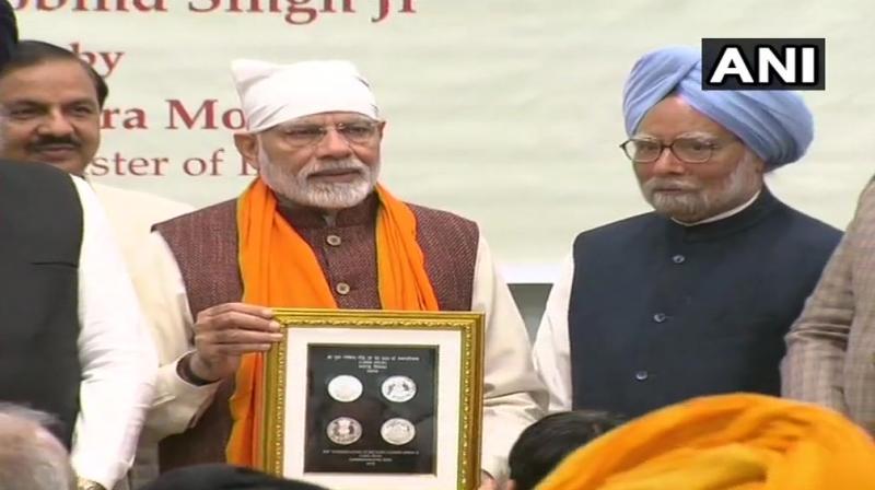 PM Modi released a commemorative coin as part of the 350th birth anniversary celebrations of 10th Sikh guru Guru Gobind Singh. (Photo: ANI)
