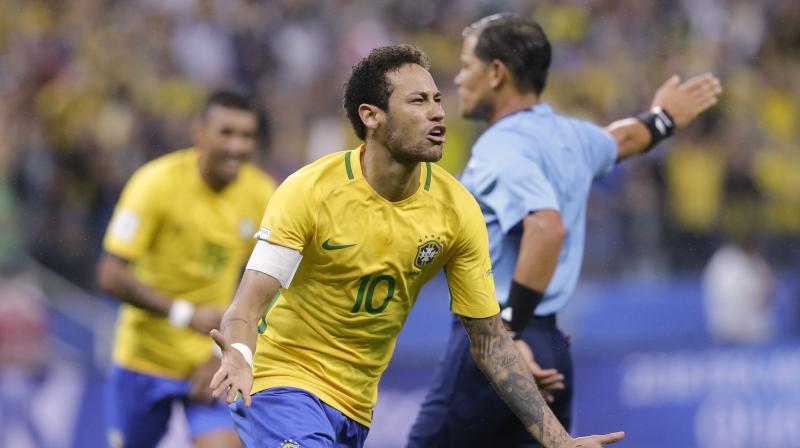 Neymar celebrates scoring his sides 2nd goal against Paraguay. (Photo: AP)