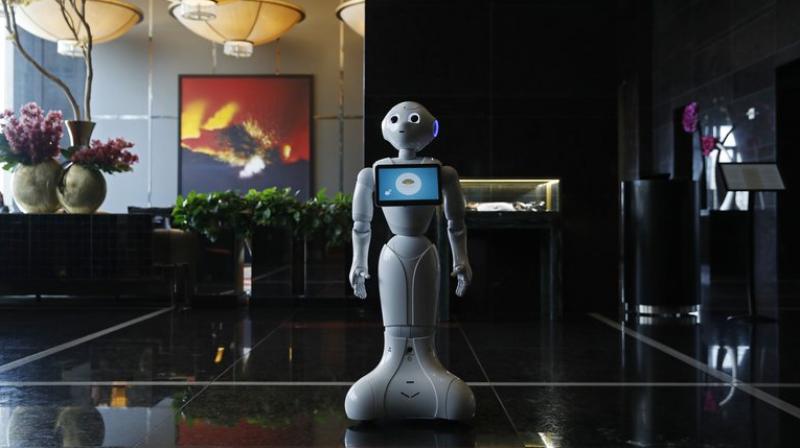 A shiny white, wide-eyed standing robot named Pepper in the lobby of the luxury Mandarin Oriental hotel can answer a set of preprogrammed questions, including checkout time, how to connect to the Wi-Fi network and the location of the spa. (Photo:AP)