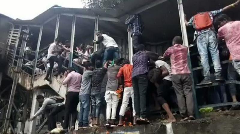At least three people were killed and 20 injured in a stampede at a foot overbridge at Elphinstone railway station in Mumbai. (Photo: Videograb)