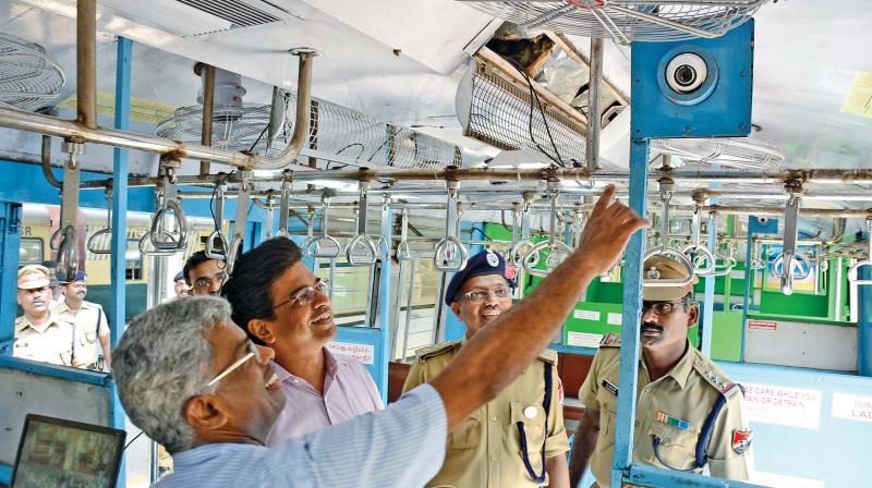Chennai divisional railway manager, Anupam Sharma, inspecting a CCTV camera installed on a pilot basis in  a ladies coach on a train from  Moore Market Complex  (MMC) to Tiruvallur (Photo: DC)