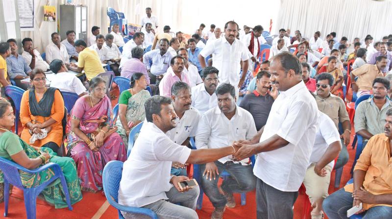 DMK candidate for RK Nagar Maruthu Ganesh meets party cadres at DMK election office in Tondiarpet. (Photo:DC)