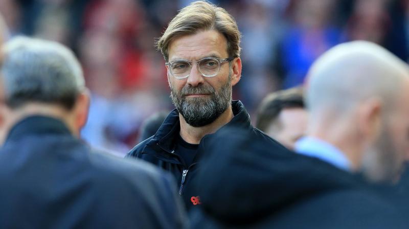 JÃ¼rgen Klopp said he wanted to see the same passion and noise from the Liverpool fans inside the ground but better behaviour on the streets outside. (Photo: AFP)
