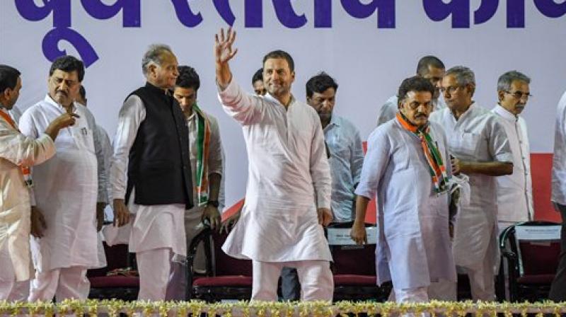 Congress President Rahul Gandhi waves as he arrives to attend a booth level meeting with his party workers, in Mumbai on Tuesday. (Photo: PTI)