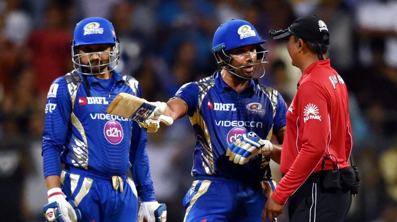 Rohit Sharma was not pleased as the on-field umpire S Ravi did not signal wide despite the ball seemed to have gone outside the tramline in the final over of Mumbai Indians chase. (Photo: PTI)