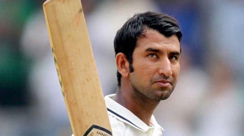 Cheteshwar Pujara got to his 16th Test fifty as India looked to close in on the 100-run mark. (Photo: PTI)