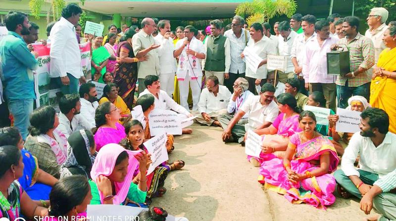 CPM city committee secretary B. Ganga Rao addresses protesters in front of the GVMC office on Friday after a rally taken out demanding shifting of the segregation centre from the residential area.