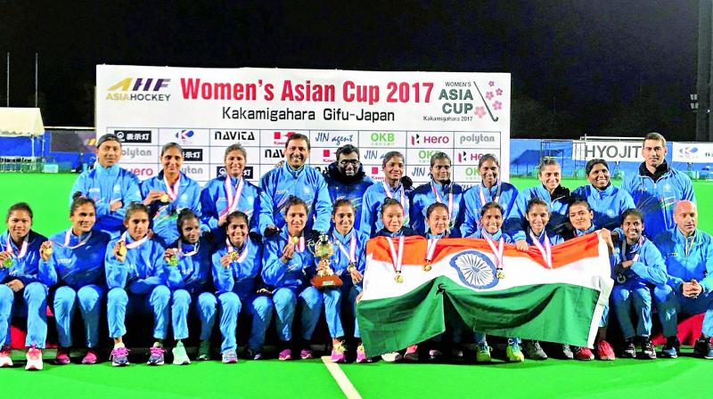 Indian womens hockey team members pose with their medals and trophy after beating China to win the Asia Cup hockey title in Kakamigahara, Japan, on Sunday. (Photo: AP)