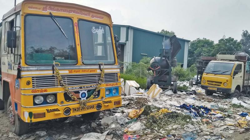 Roads in Guindy Industrial Esate near Olympia IT park filled with garbage and crowded by badly parked trucks.