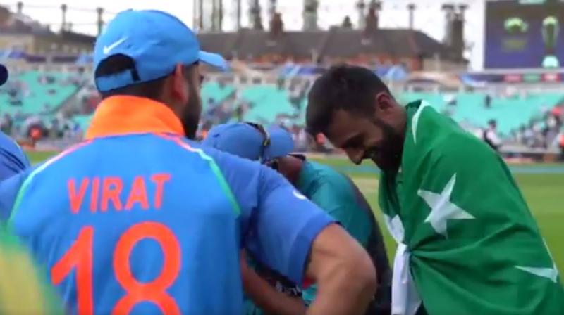 Virat Kohli and Shoaib Malik share a candid moment after Pakistans 180-run victory over India in the ICC Champions Trophy final. (Photo: ICC/ Screengrab)