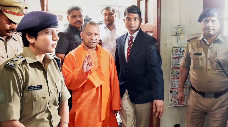 UP Chief Minister Yogi Adityanath during a surprise visit at the Hazratganj police station in Lucknow. (Photo: PTI)