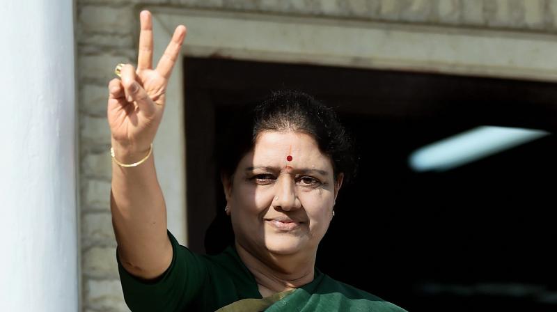 Sasikala flashes a victory sign after attending the party MLAs meeting in which she was elected as a AIADMK Legislative party leader. (Photo: PTI)
