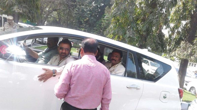 Hosapete BJP MLA Anand Singh  and Ballari district in-charge minister Santosh Lad were spotted travelling in the same car with speculation rife that Mr Singh will join the Congress ahead of the polls.