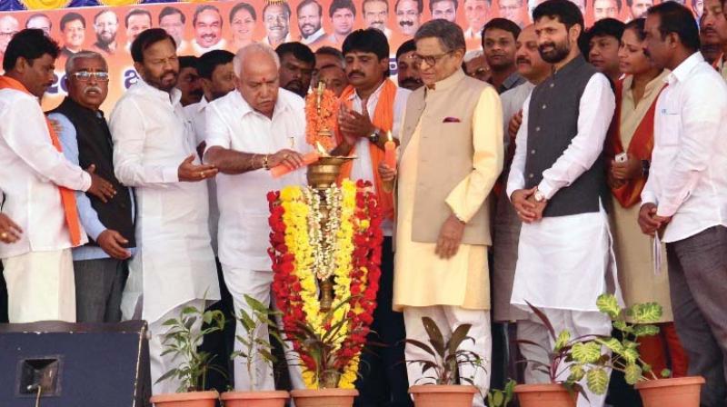 BJP state president B.S. Yeddyurappa and former CM S.M. Krishna at the BJPs Parivarthana Yatra in Mandya on Friday.