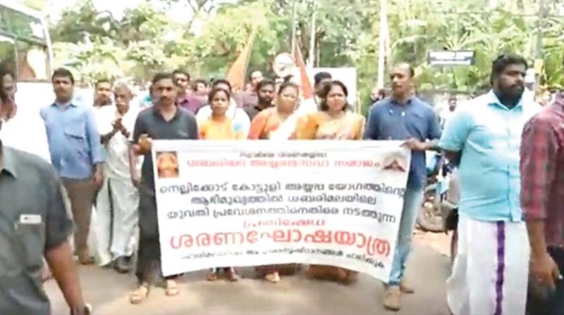 The Hindu Aikya Vedi workers take out a protest march to Government Higher Secondary School, Medical College campus, Kozhikode, where Ms Bindu Kalyani works