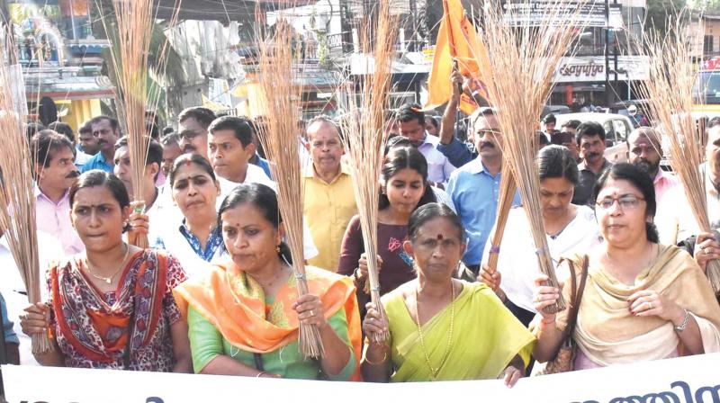 Sabarimala Karma Samithi activists take out a protest march to Palarivattam BSNL office demanding sacking of BSNL employee Rehana Fathima for her action to proceed to Sabarimala 	Arun Chandrabose